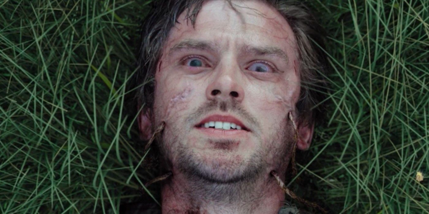 Dan Stevens as Thomas in the grass in Apostle