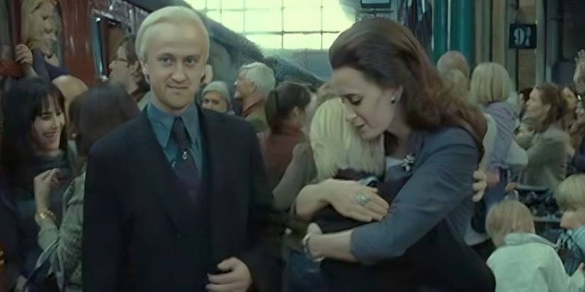 Draco (Tom Felton) and Astoria Malfoy (Jade Olivia) at the train station with their son in Deathly Hallows Part 2
