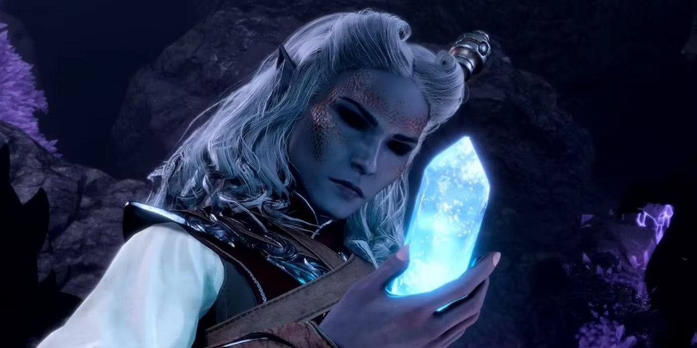 An elven sorcerer holding a blue crystal in her hand.