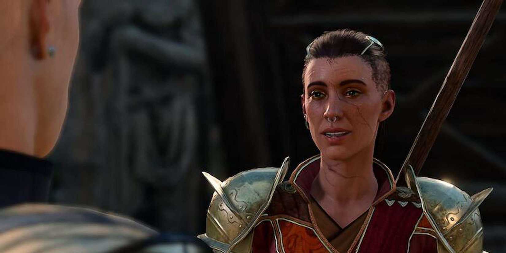 Blaze Elin, an armored guard at Wyrm's Rock Fortress, stands in front of a player character in Baldur's Gate 3.