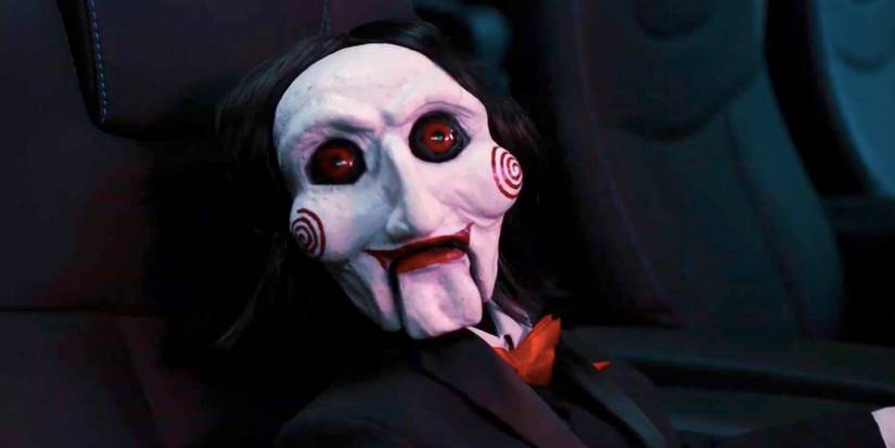 Billy the Puppet Sitting in a Movie Theater Seat