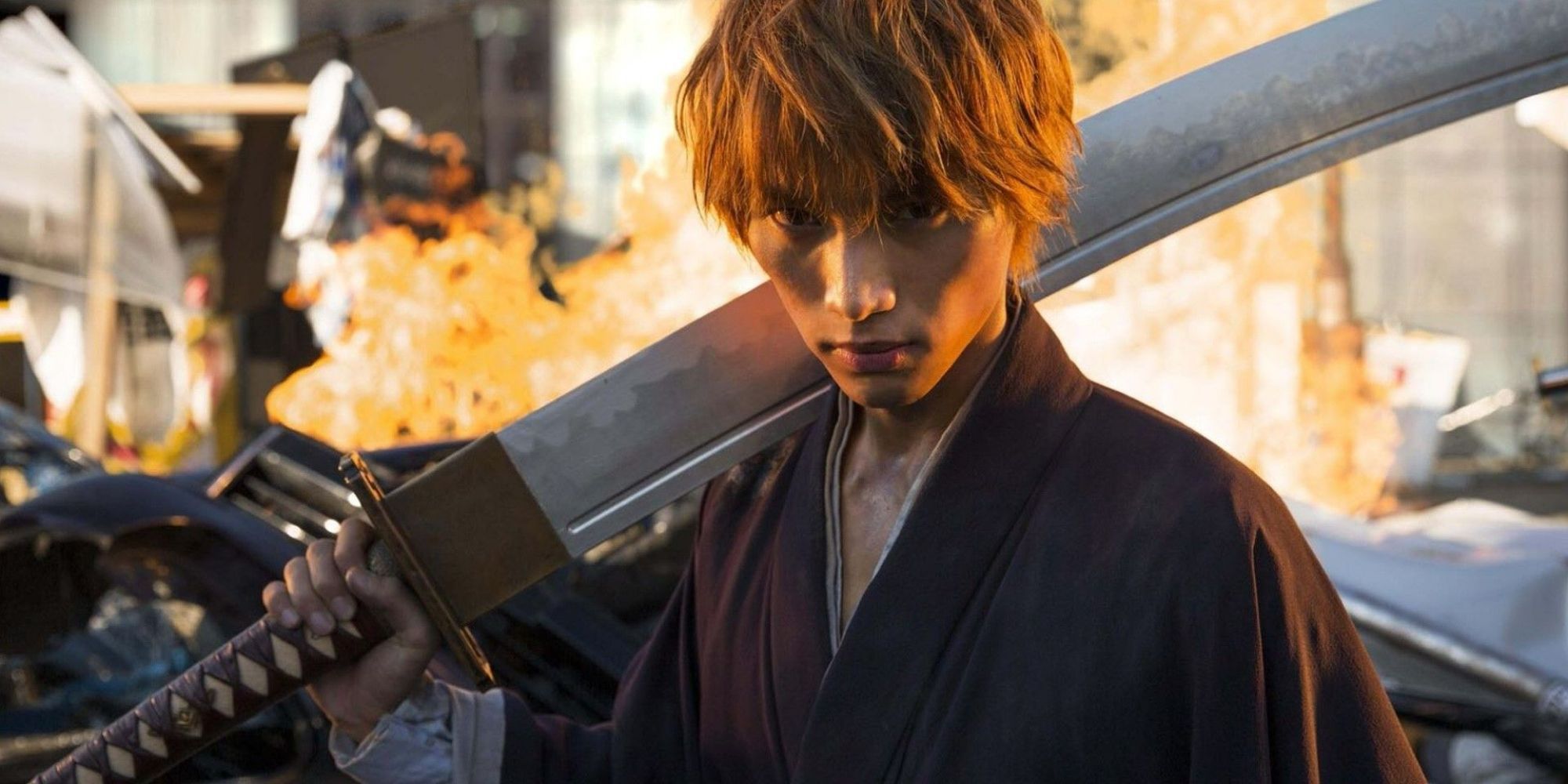 A young man stands with his sword leaning against his shoulder in the live-action movie for Bleach