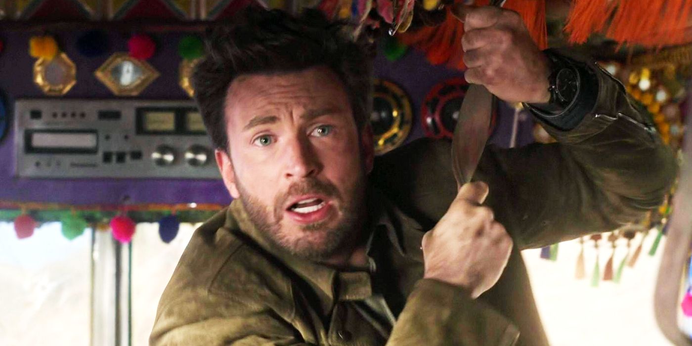 Chris Evans holding onto a strap in a bus and looking worried in Ghosted.