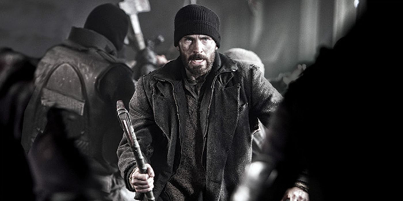 Chris Evans holding an axe and looking angry in Snowpiercer.