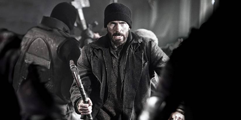 Chris Evans holding an axe and looking angry in Snowpiercer