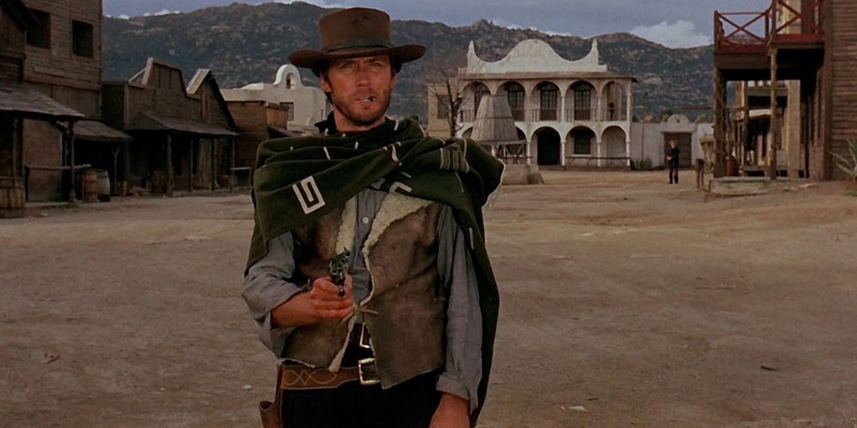 Clint Eastwood as the Man with No Name with a gun in A Fistful of Dollars