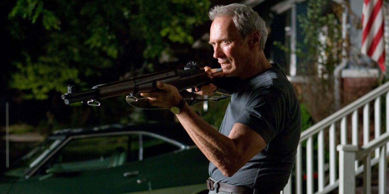 Clint Eastwood with a shotgun in Gran Torino