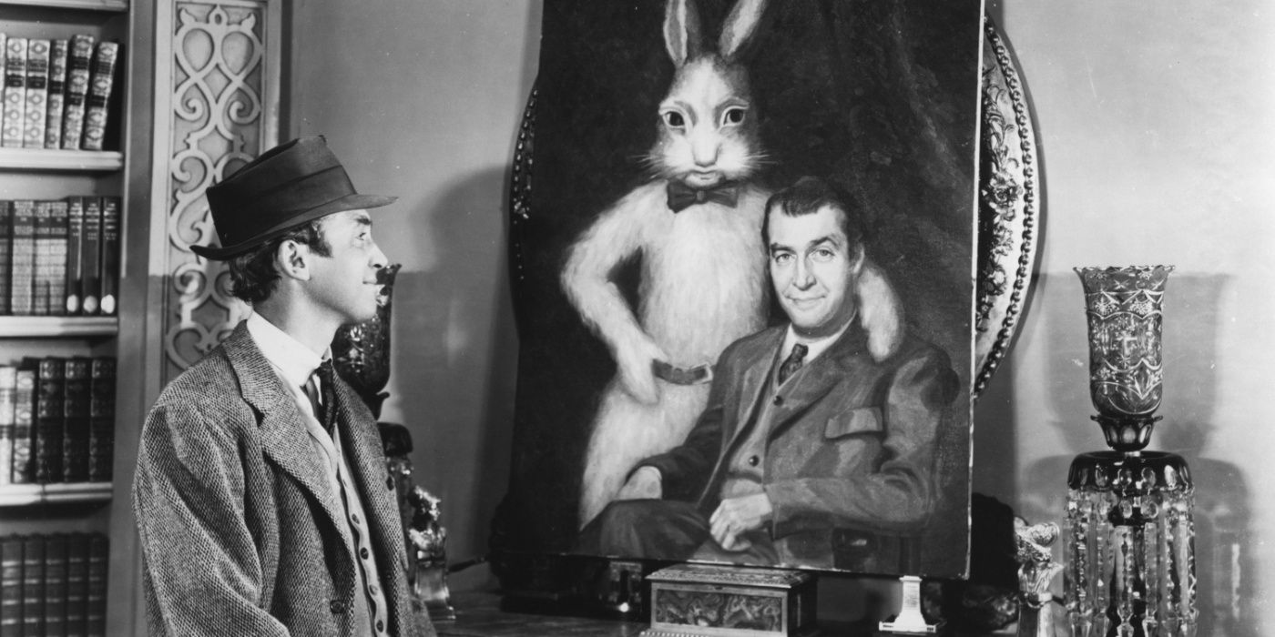 Elwood looks at a painting of a rabbit in Harvey
