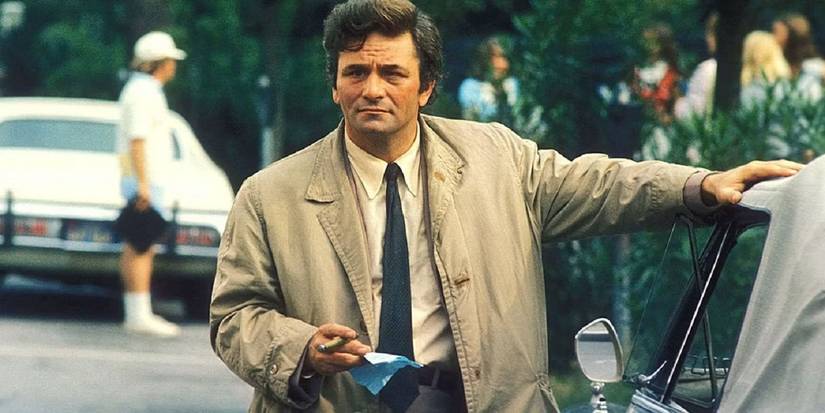 Columbo standing by a car 