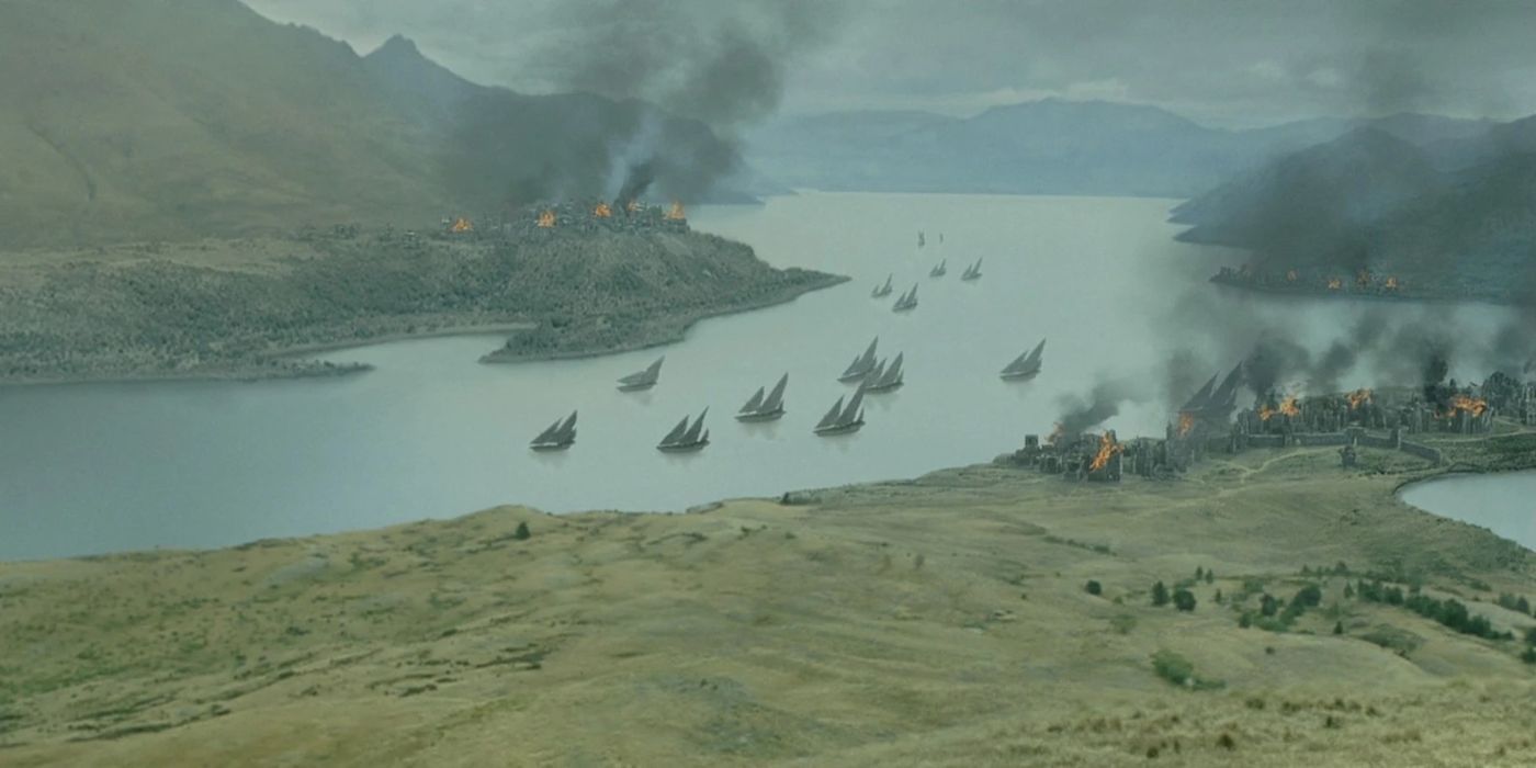 Corsair of Umber ships sailing up a river as Pelargir and other towns burn in the Extended Edition of The Return of the King.