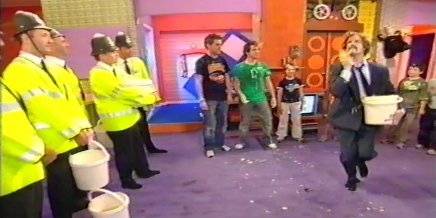 A man carries a bucket on Dick &amp; Dom in da Bungalow