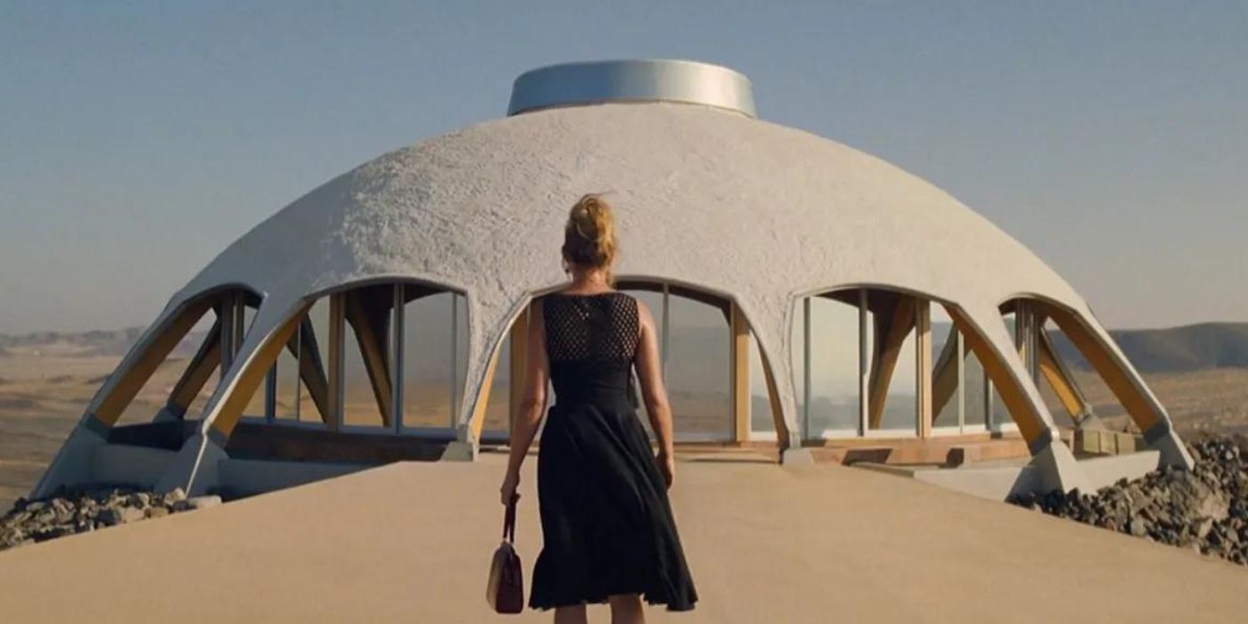 Florence Pugh as Alice in Don't Worry Darling explores a strange desert structure