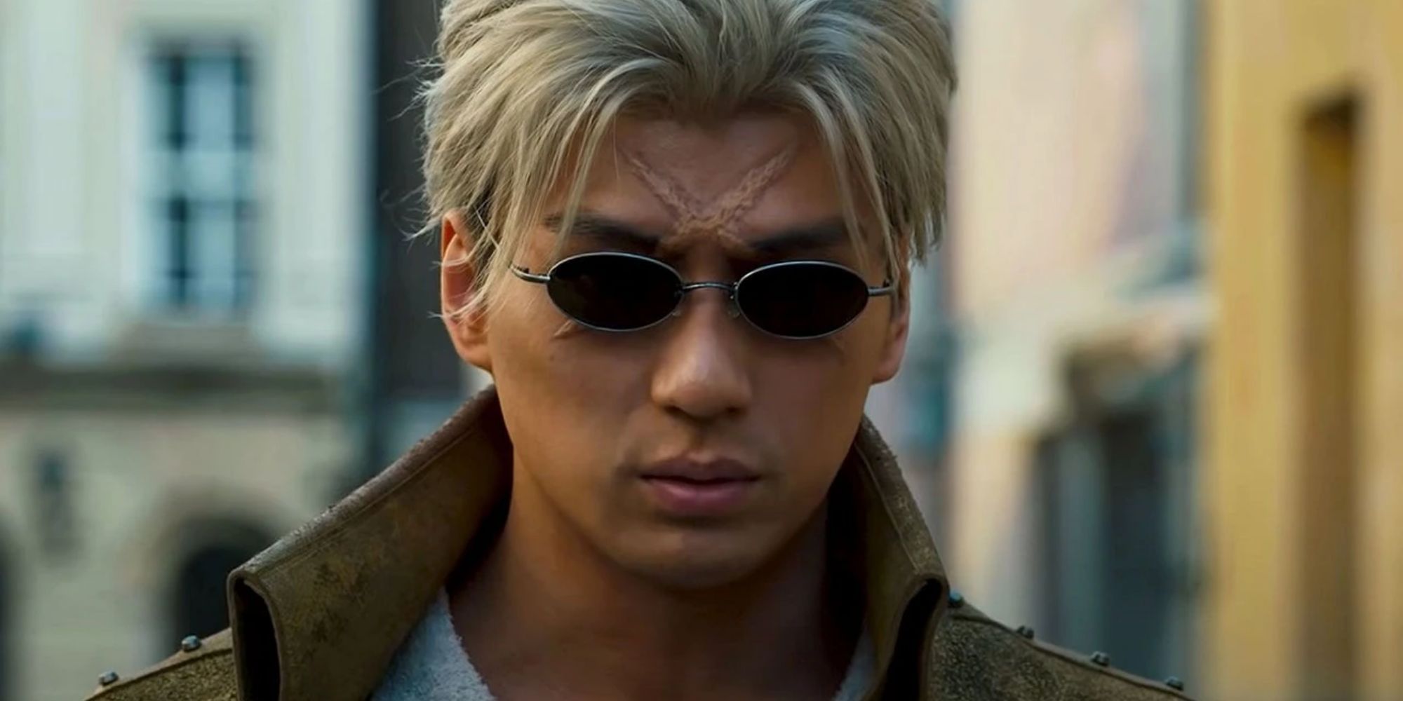 The man with the scar on his head wearing sunglasses in the live-action Fullmetal Alchemist: Revenge Of Scar