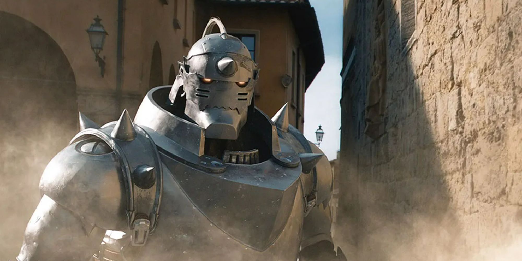 A character in full robotic armor in an alleyway next to a stone wall in the live-action Fullmetal Alchemist