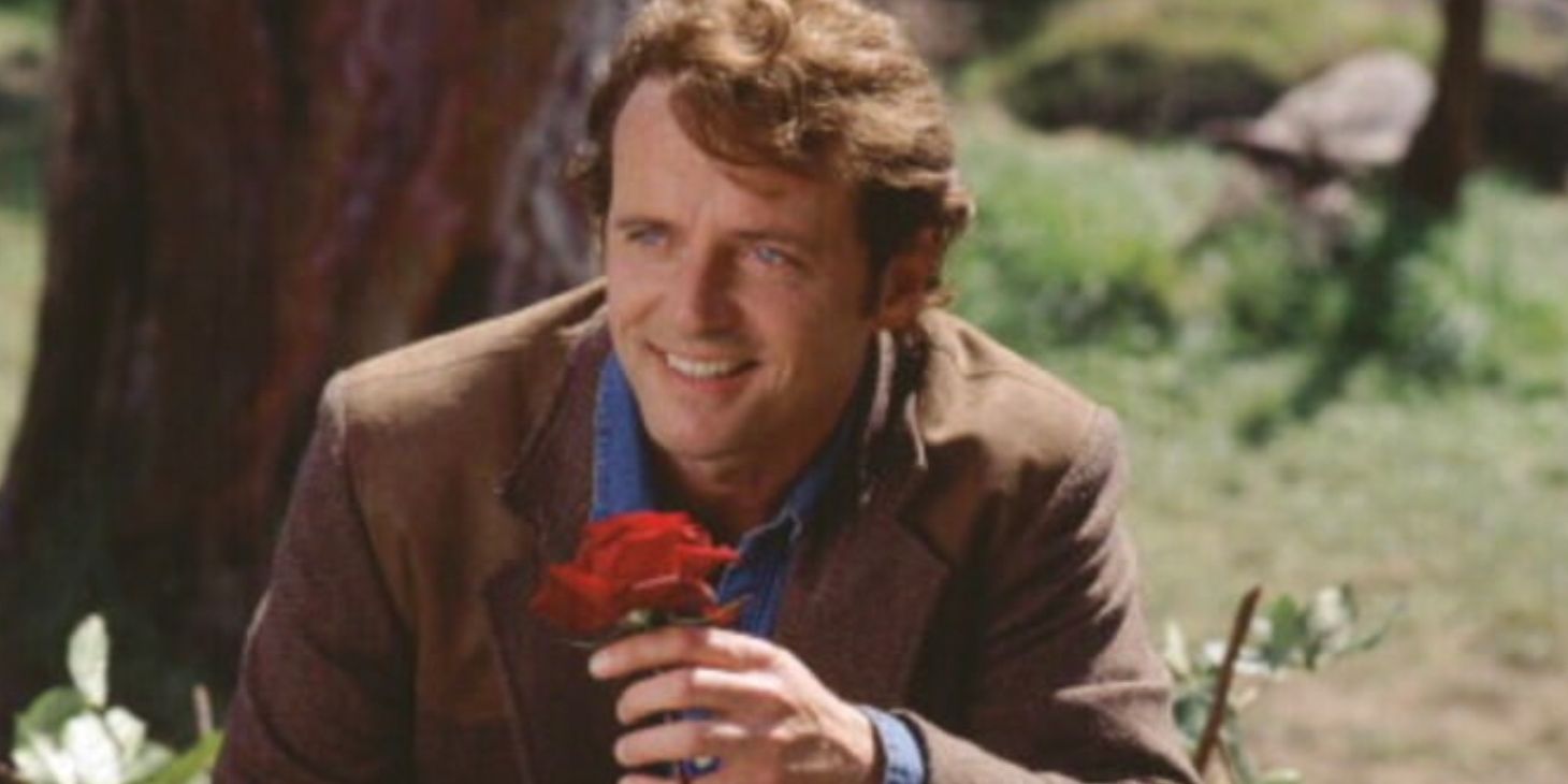 Gary Hallet smiling and holding a rose in Practical Magic