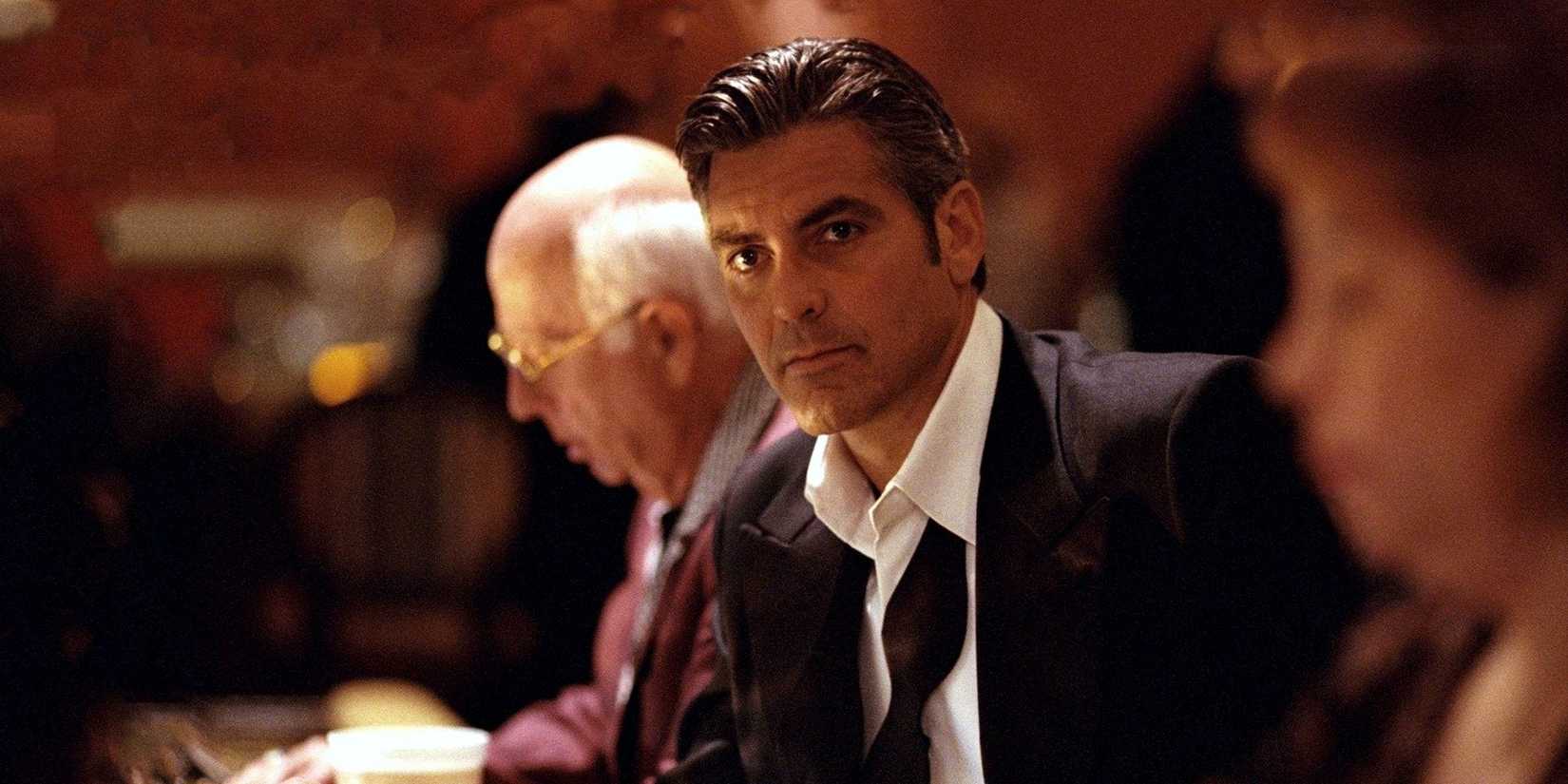George Clooney wearing a tux and looking off at something as Danny Ocean in Ocean's Eleven.