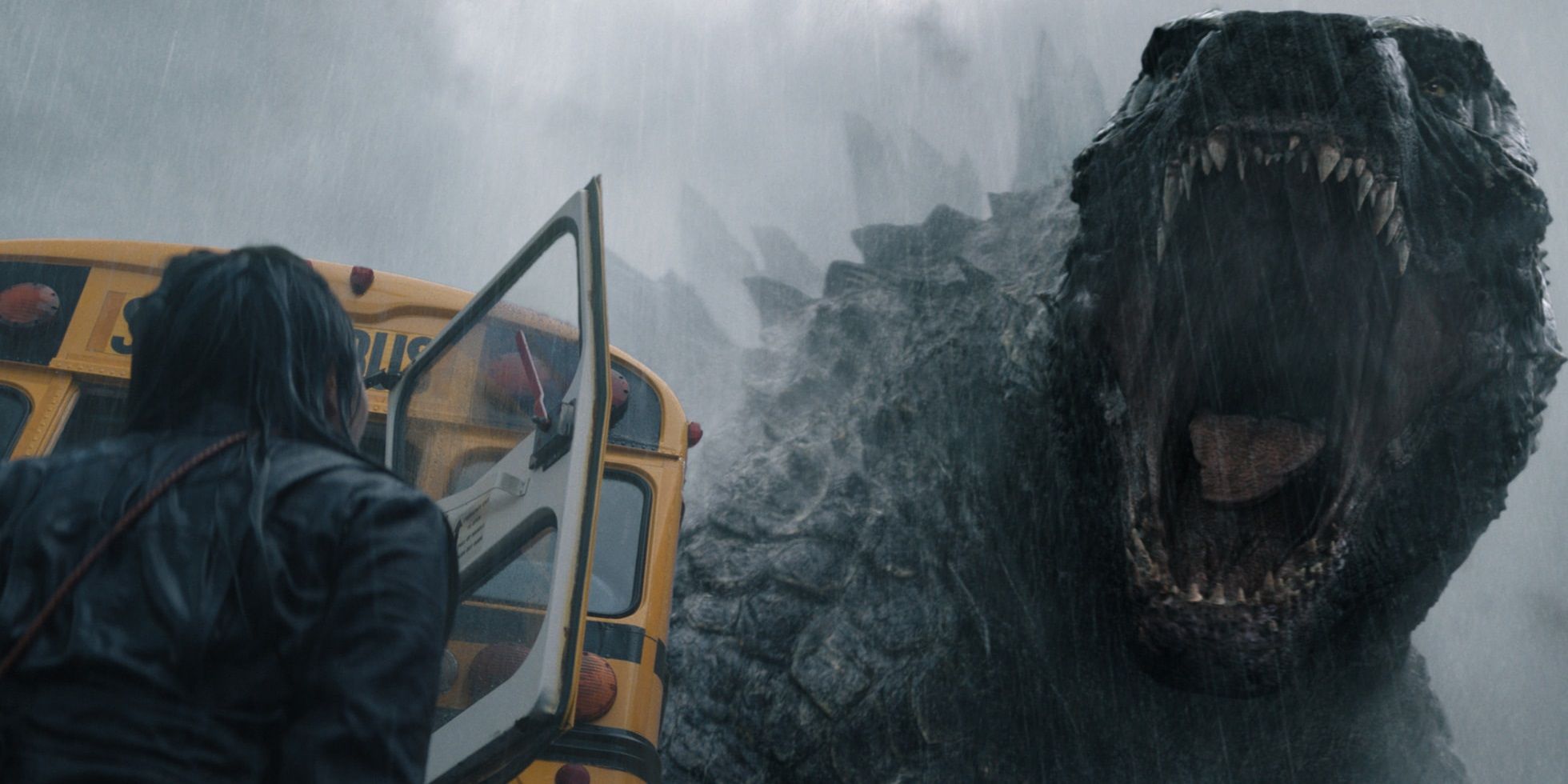 Godzilla roars next to a school bus in Monarch Legacy of Monsters
