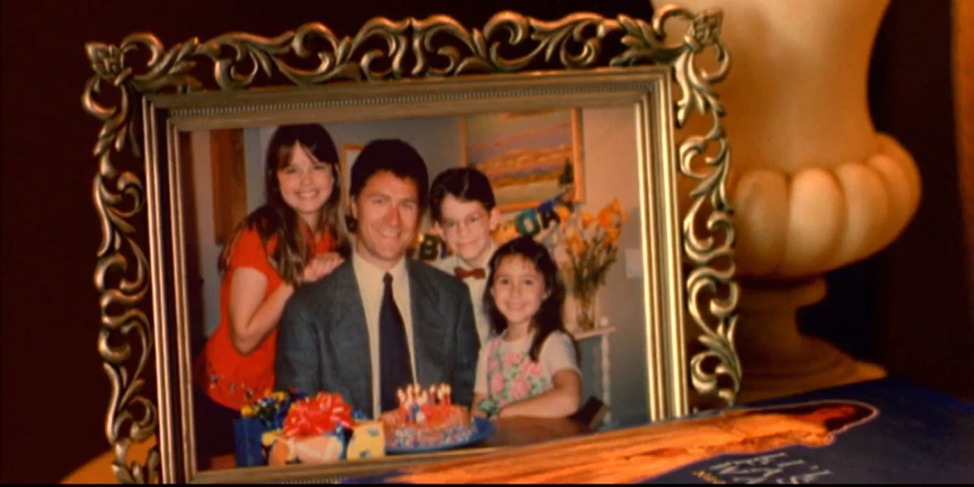 A photo in Halloweentown that depicts Marnie, Dylan, and Sophie with their father