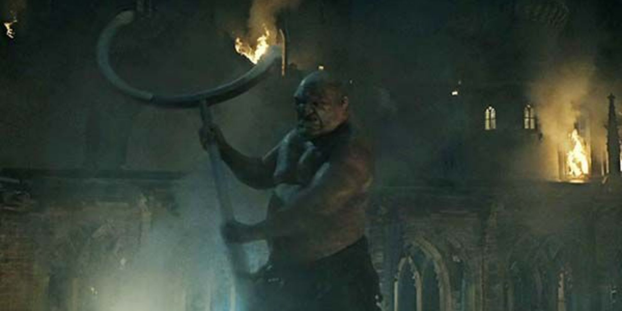 A giant lifting a weapon in the Battle of Hogwarts in Harry Potter