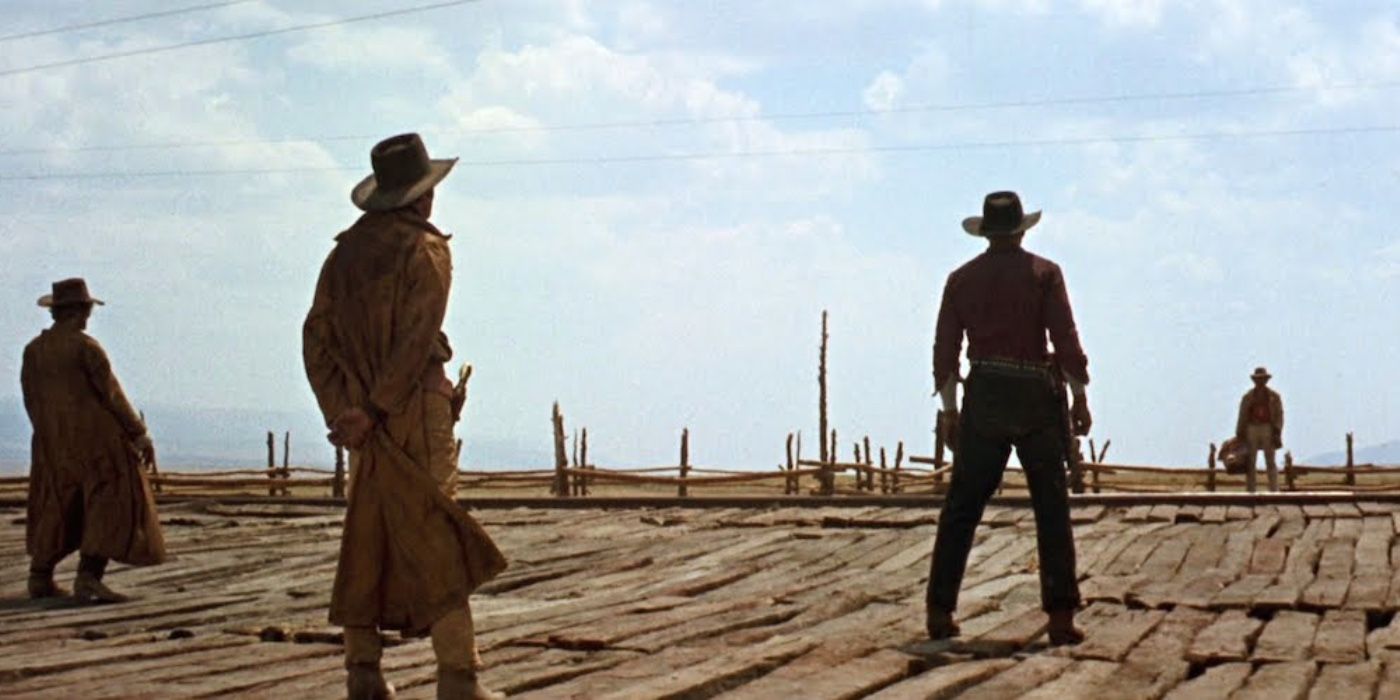 The three gunfighters confront Harmonica at the train station in Once Upon A Time In The West.