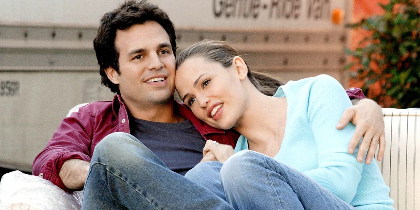 Jenna and Matty cuddling on a couch by a moving van in 13 Going on 30.