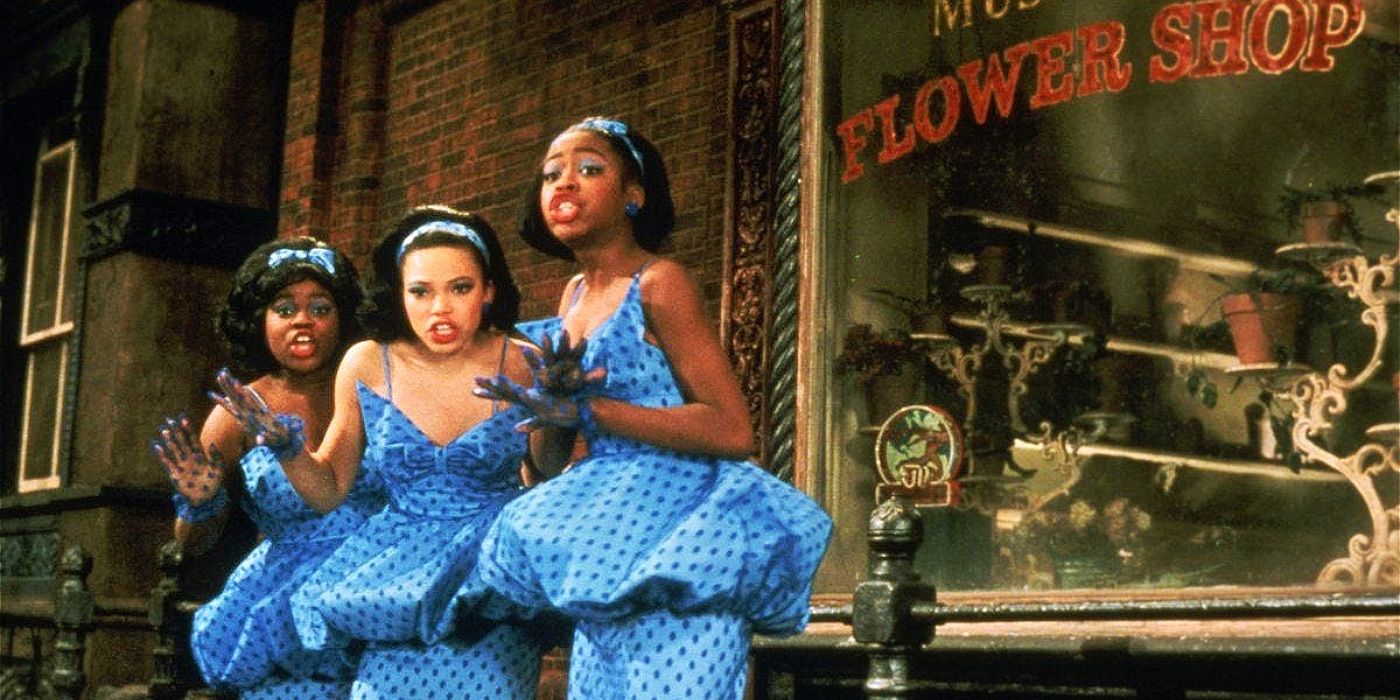 The Greek chorus is outside the flower shop on Skid Row in Little Shop of Horrors.