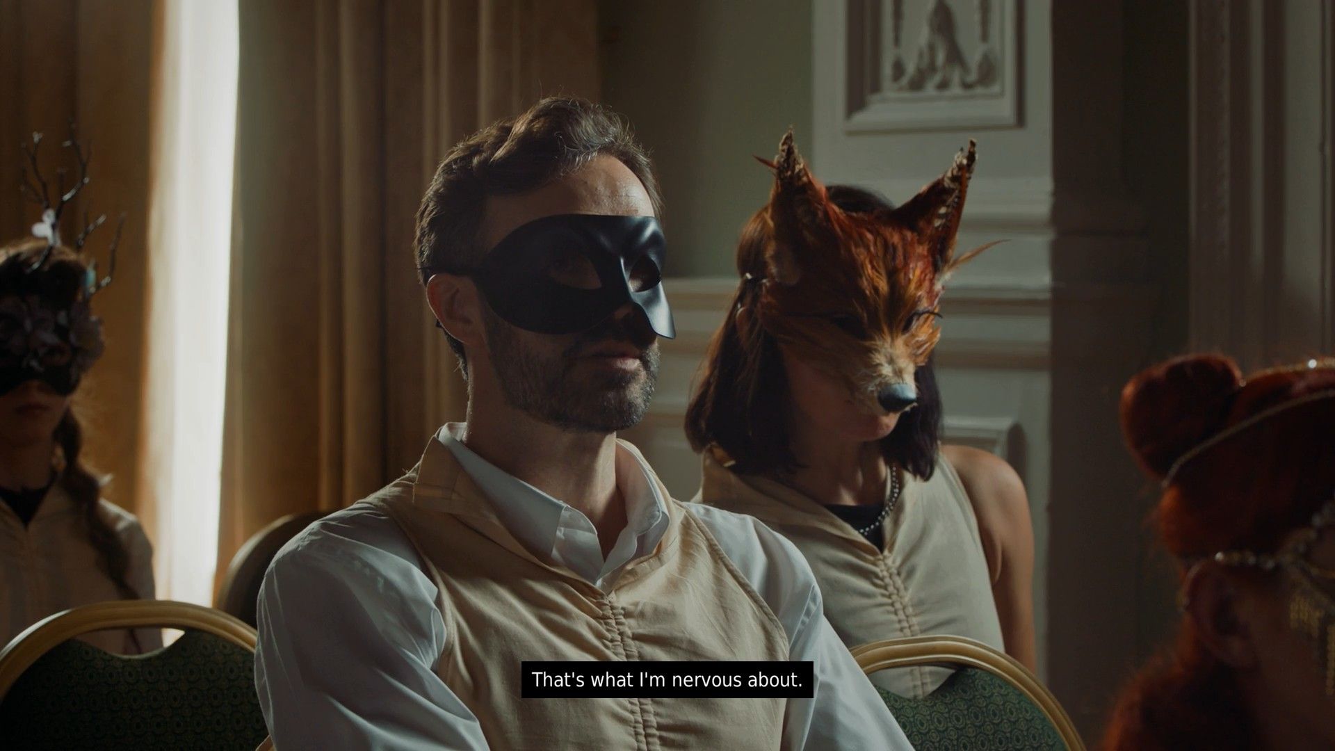Isle Tide Hotel scene showing a woman in a fox mask talking to Josh in a black mask.