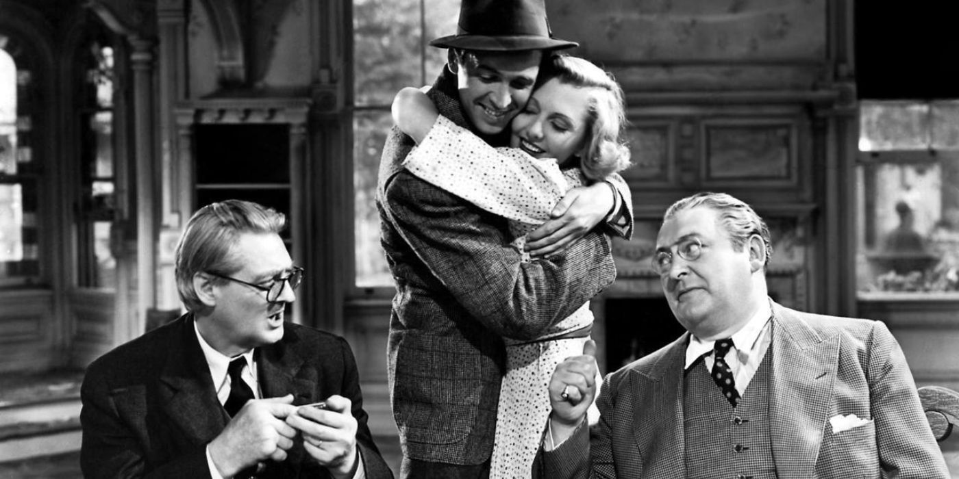 James Stewart and Jean Arthur embracing in You Can't Take It With You 