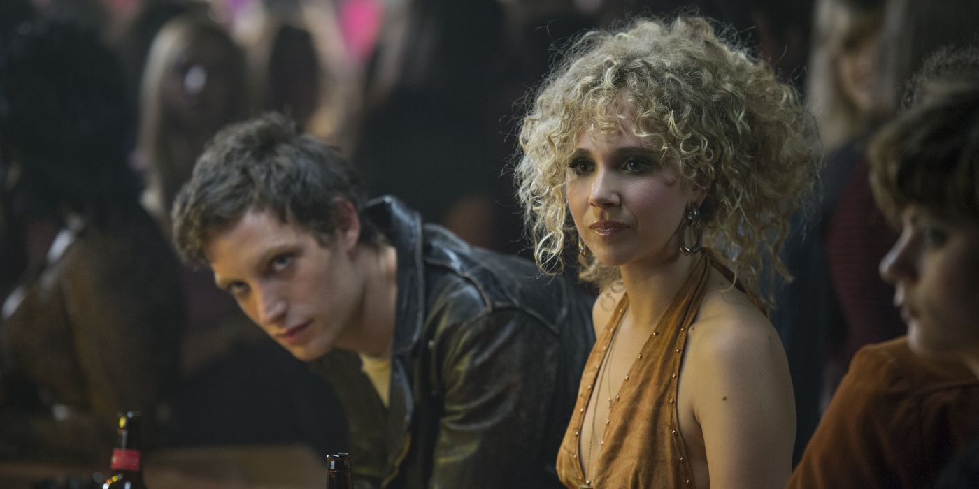 Jamie looking at someone off screen in Vinyl.