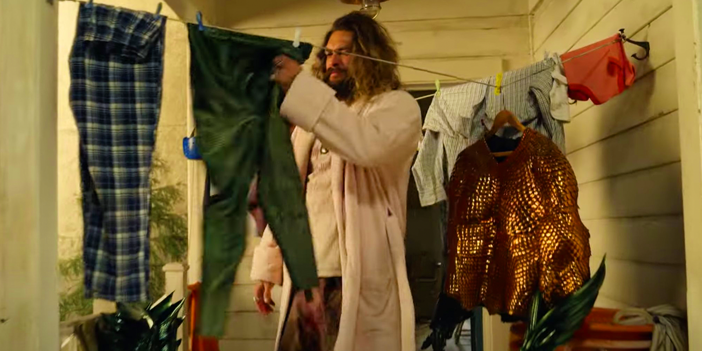 Jason Momoa as Arthur Curry drying his suit in Aquaman and the Lost Kingdom