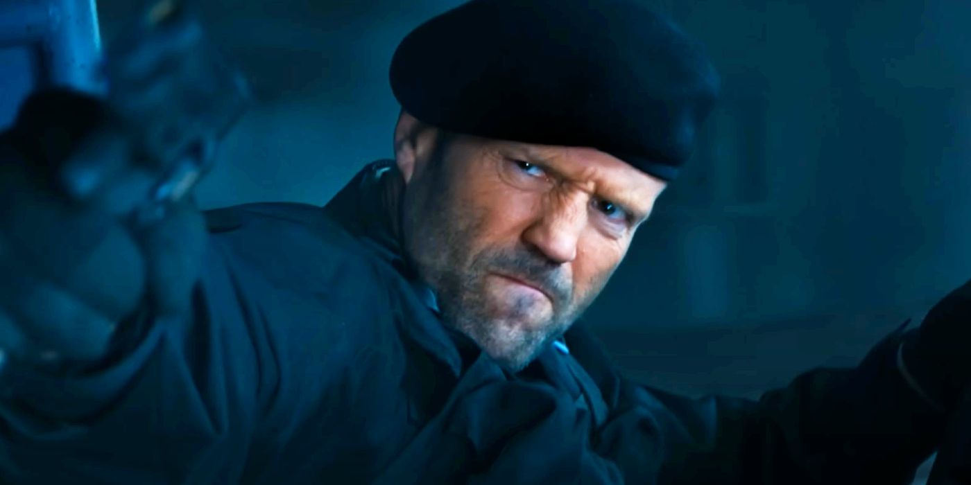 Jason Statham pointing a gun as Lee Christmas in The Expendables 4.