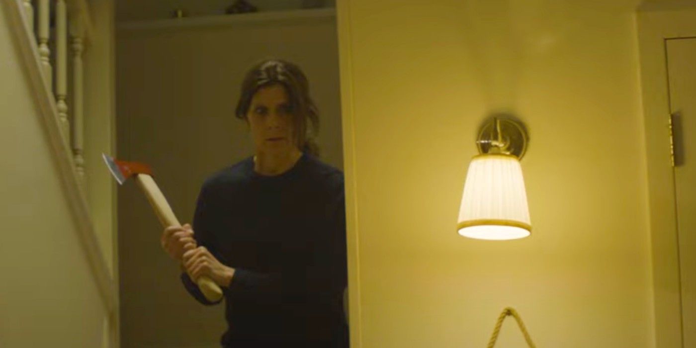 A woman wielding an ax in John Carpenter&rsquo;s Suburban Screams.