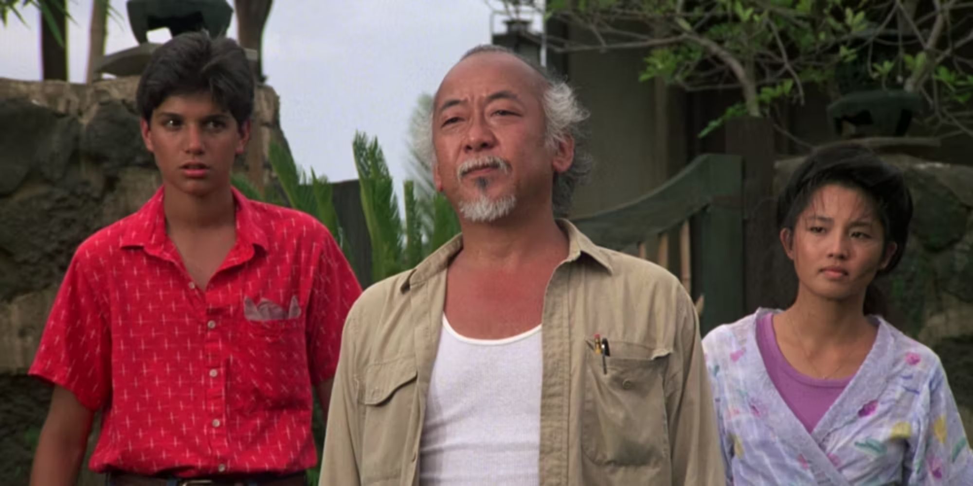 Miyagi, Kumiko, and Daniel are heading somewhere in Karate Kid Part 2