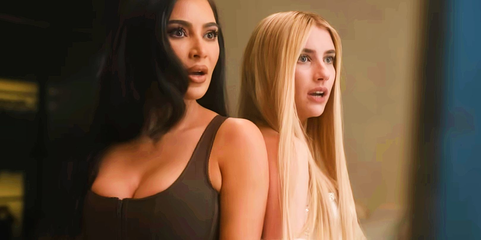 Kim Kardashian and Emma Roberts looking stunned in American Horror Story season 12