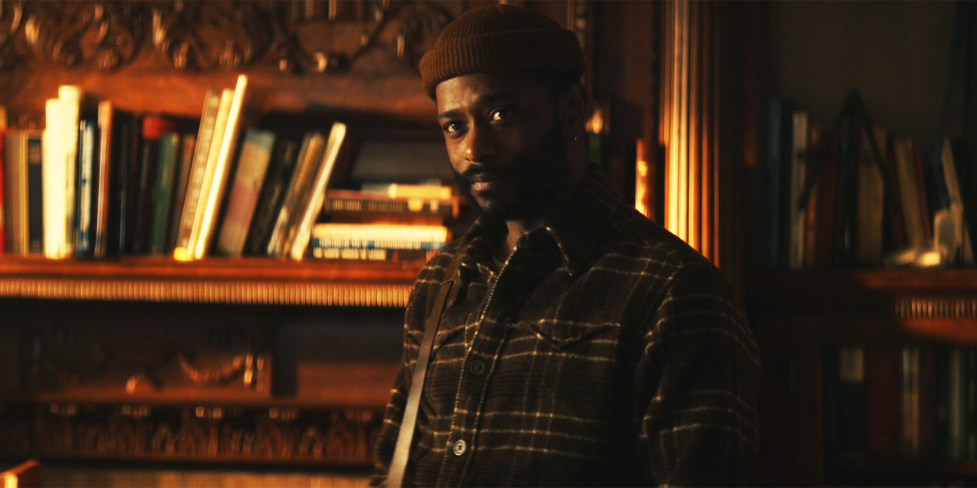 LaKeith Stanfield in The Changeling episode 1 surrounded by books