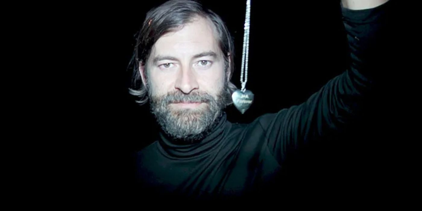 Mark Duplass character holds a heart-shaped necklace in the Creep movies