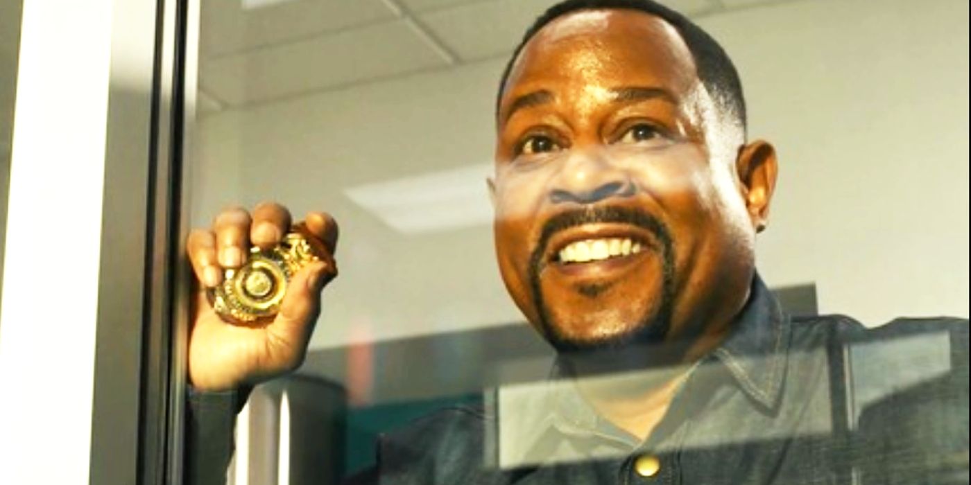 Martin Lawrence as Marcus Burnett holding a police badge and smiling in Bad Boys For Life.