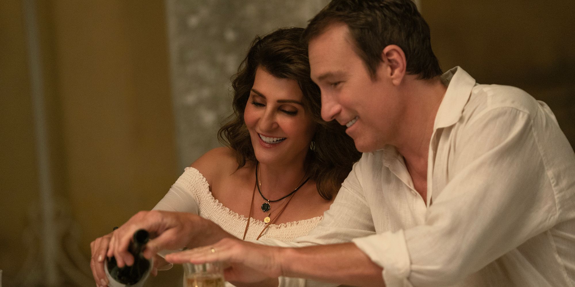 Nia Vardalos as Toula and John Corbett as Ian drinking wine in My Big Fat Greek Wedding 3