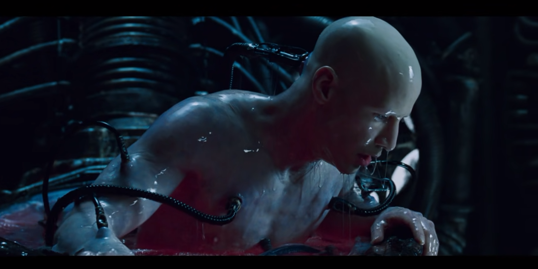 Neo wakes up from the Matrix, bald and plugged into tubes in his pod