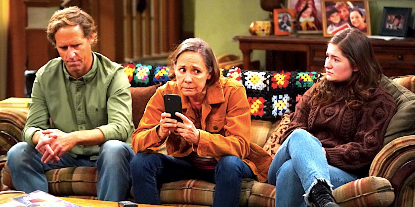 Nat Faxon's Neville Laurie Metcalf's Jackie and Emma Kenney's Harris sit on the couch together in The Conners