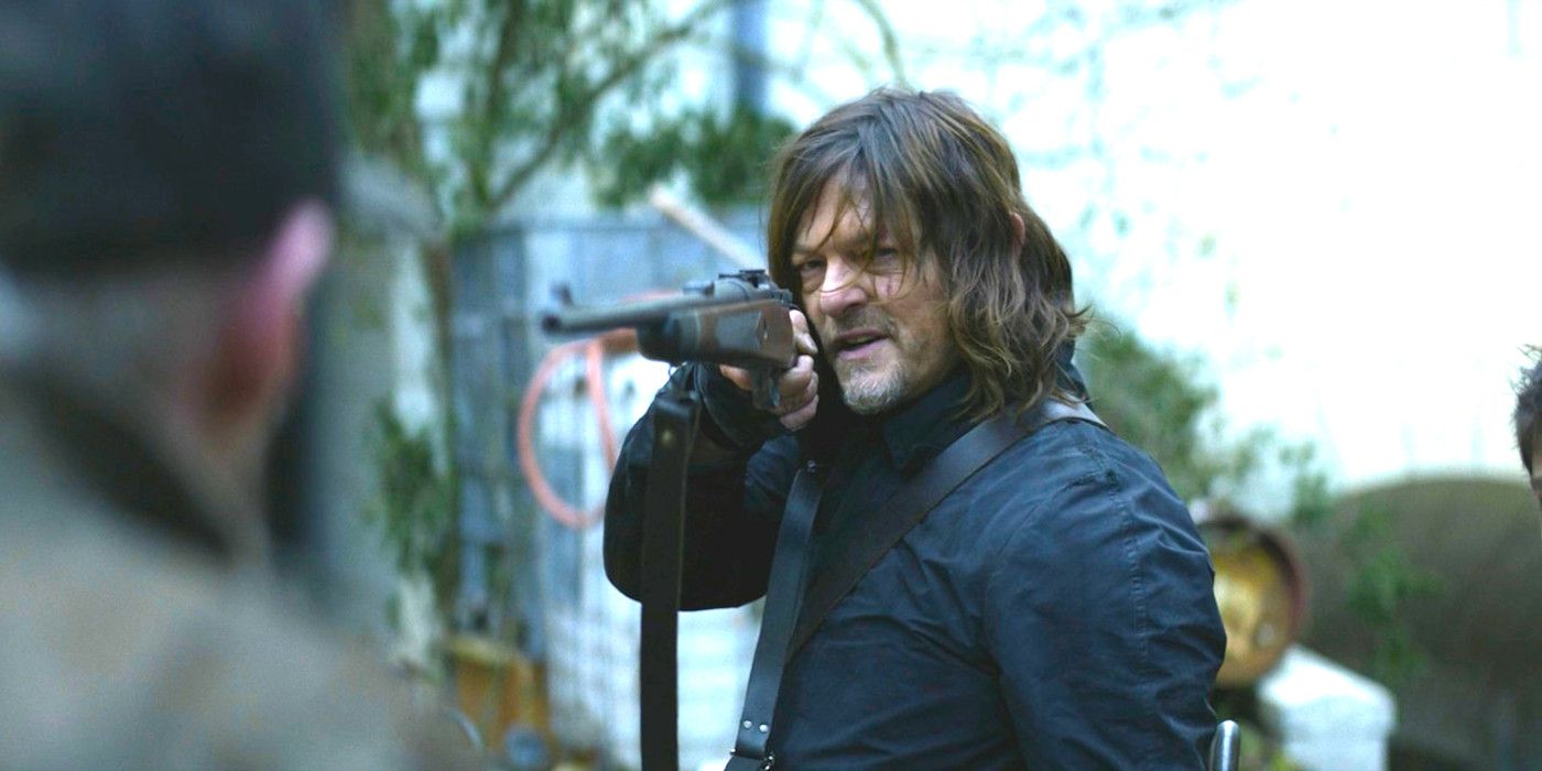 Norman Reedus angrily pointing a rifle at a man in The Walking Dead Daryl Dixon-1