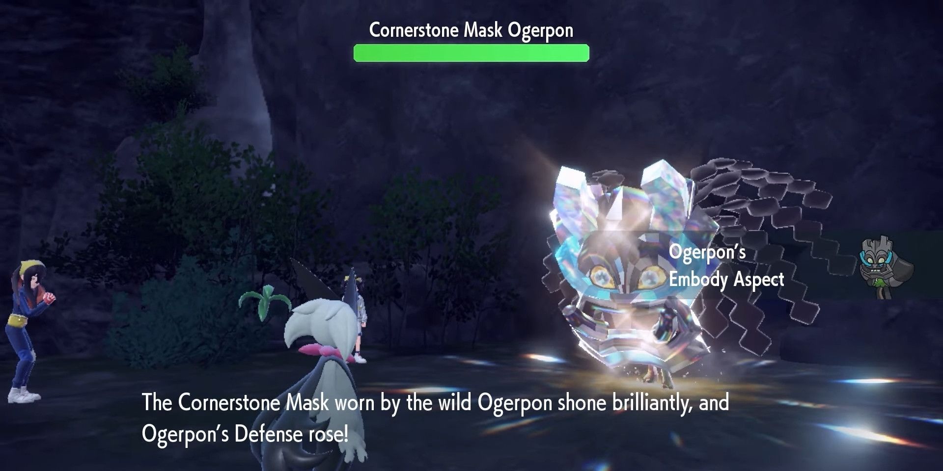 Ogerpon from Pokémon Scarlet and Violet with a giant grey mask.