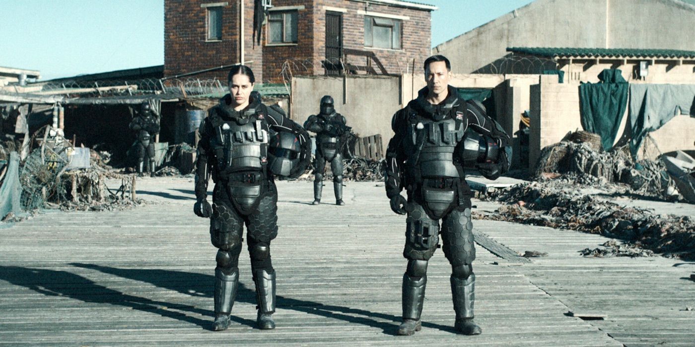 People in armor watch Resident Evil 