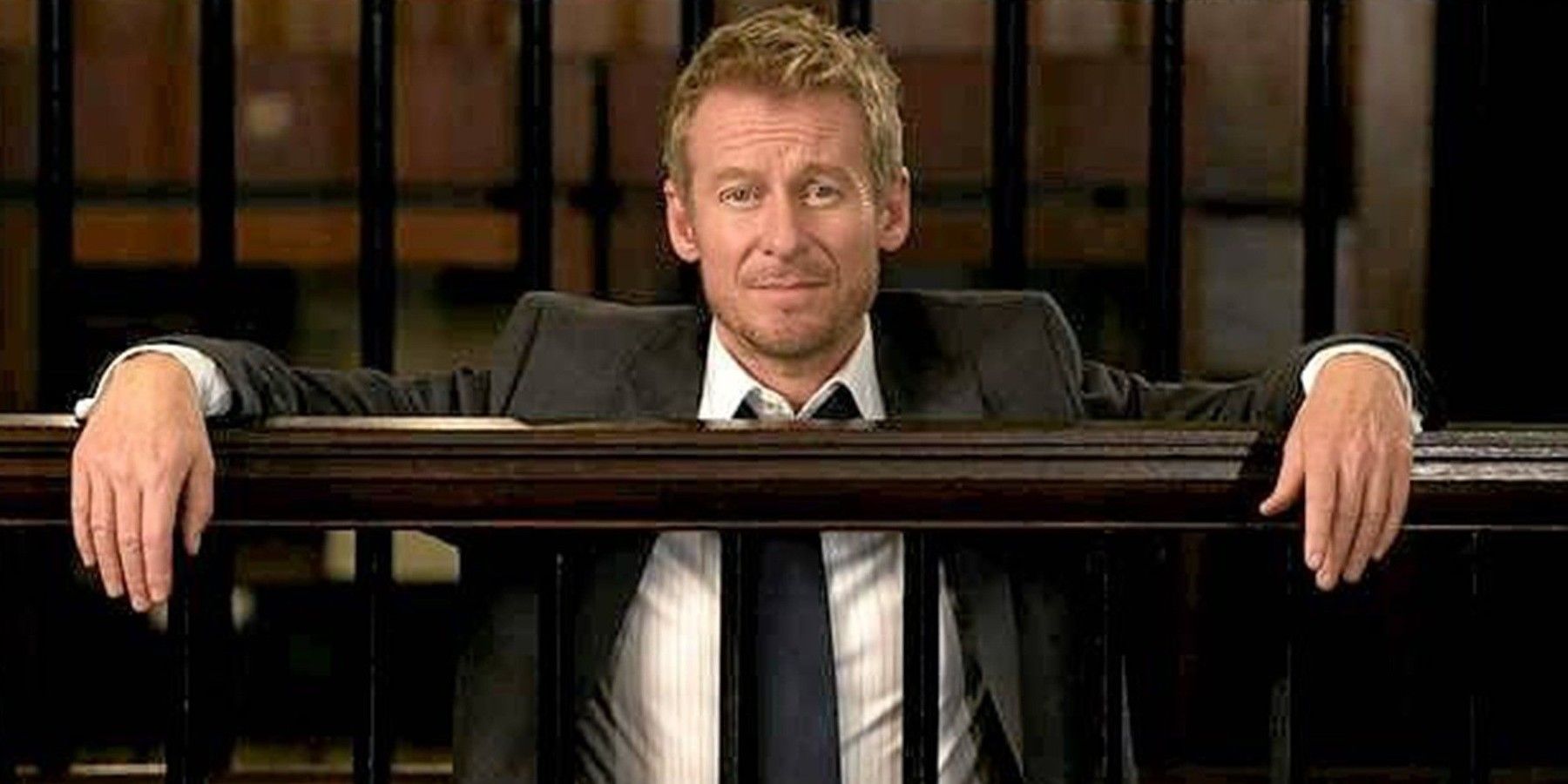 Richard Roxburgh leaning in a courtroom in Rake