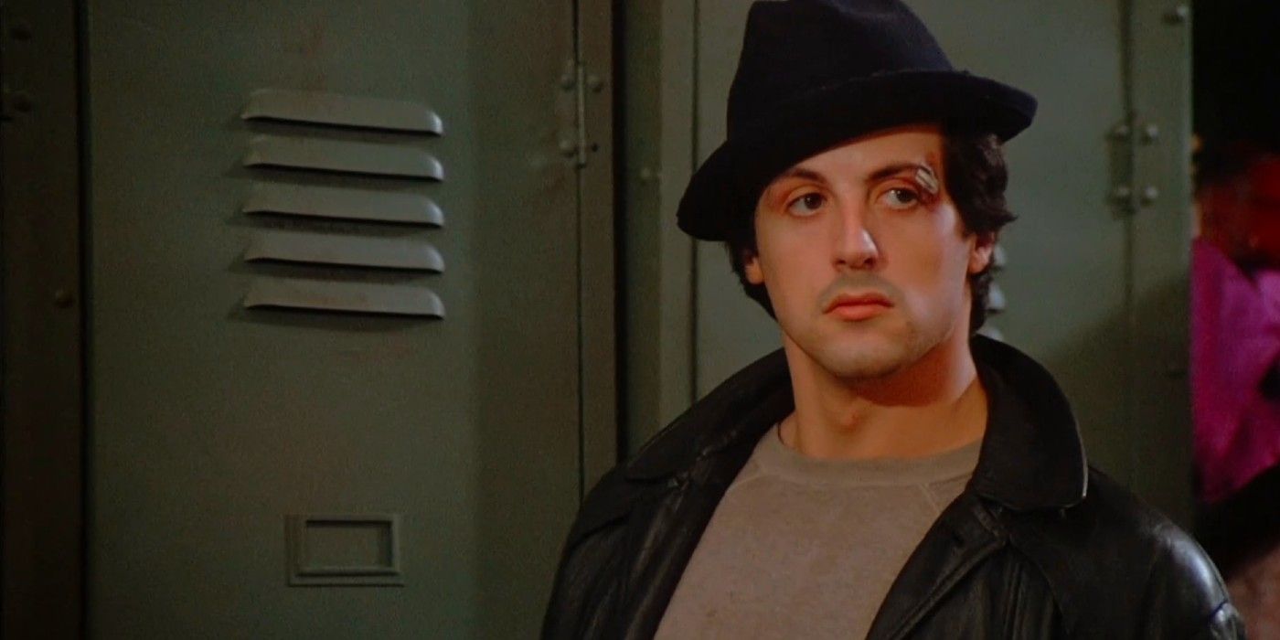 Rocky Balboa (Sylvester Stallone) stands next to the lockers in Rocky (1976).