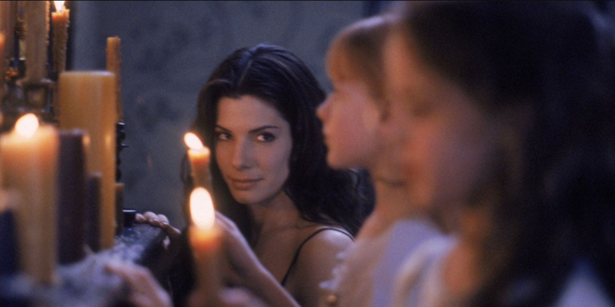 Sally and her daughters lighting candles in Practical Magic
