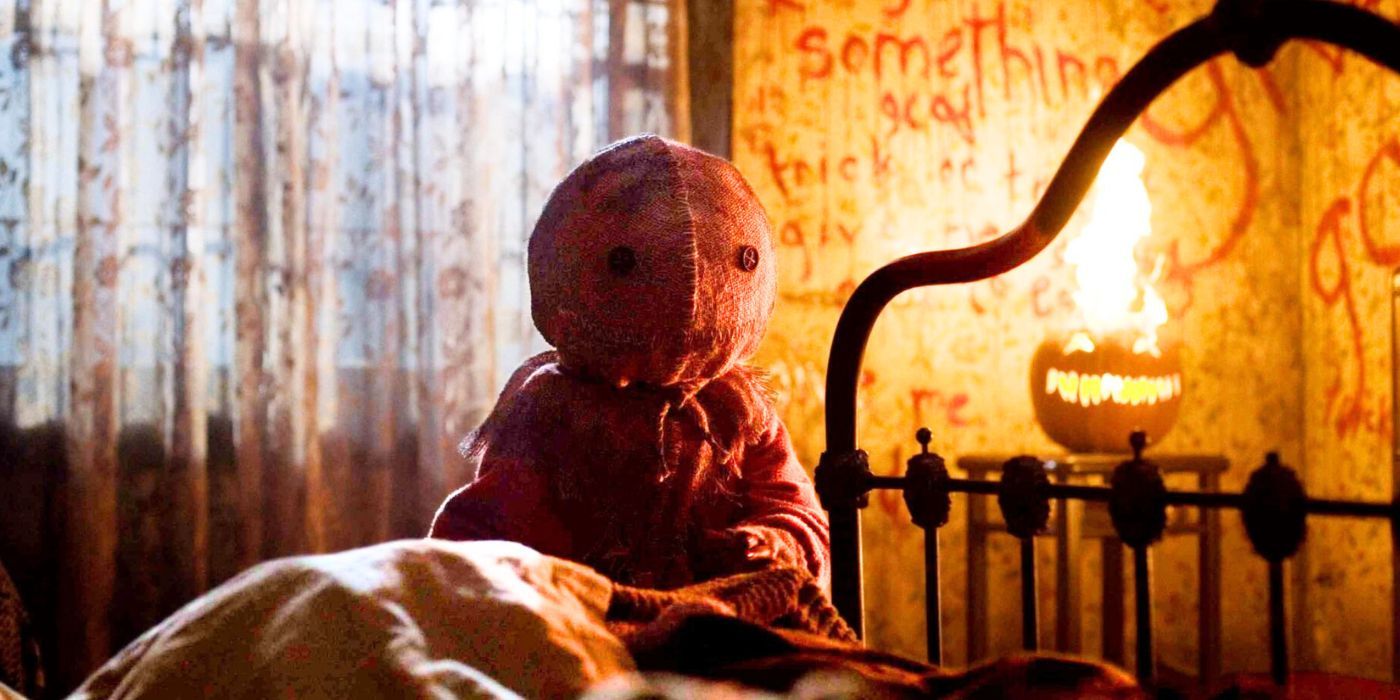 Sam looms over a bed in Trick R Treat