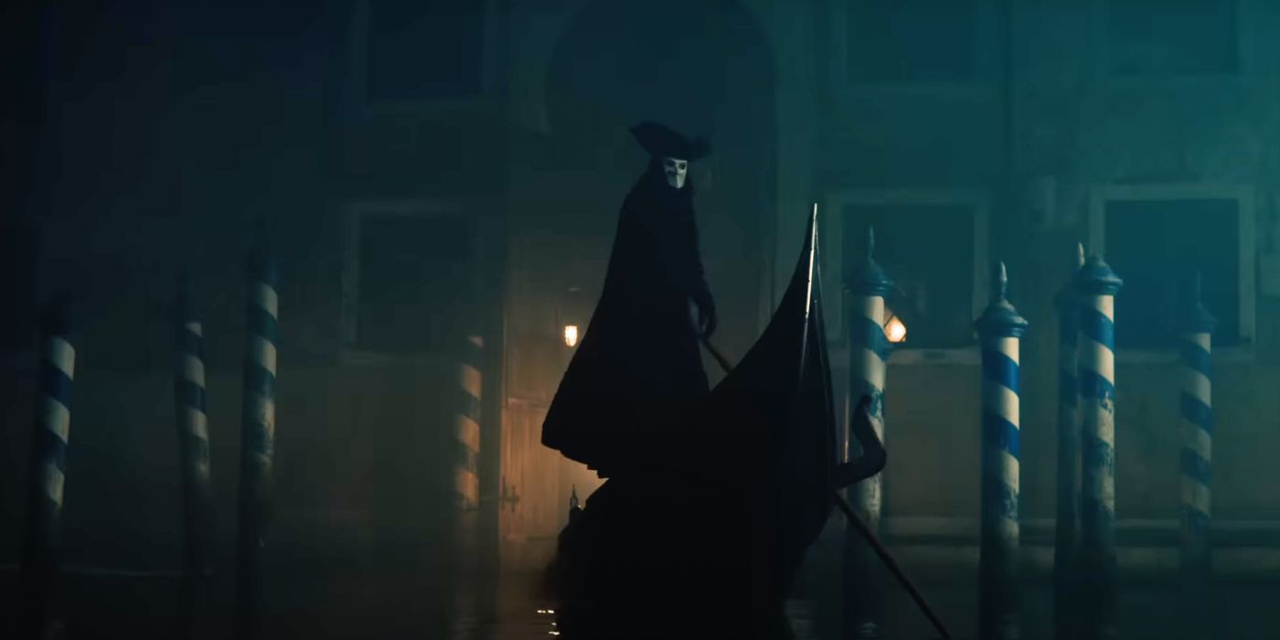 A masked man on a gondola in A Haunting in Venice