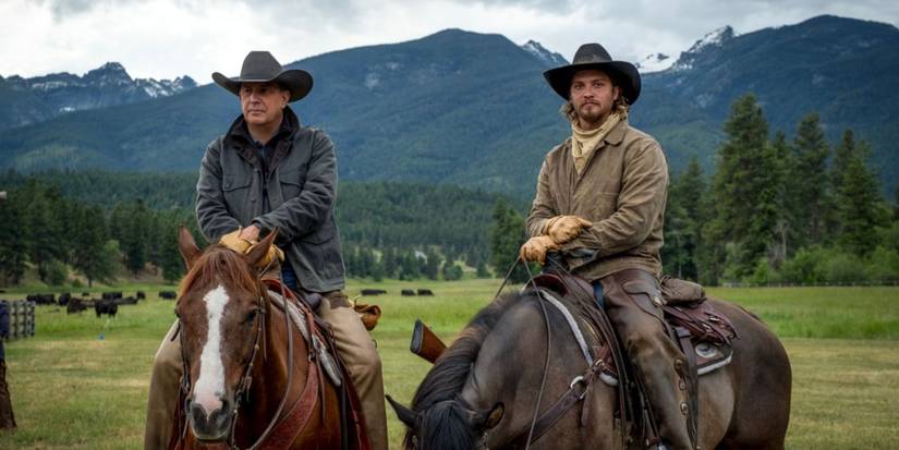 Kevin Costner and Luke Grimes as John and Kayce Dutton on horseback in Yellowstone