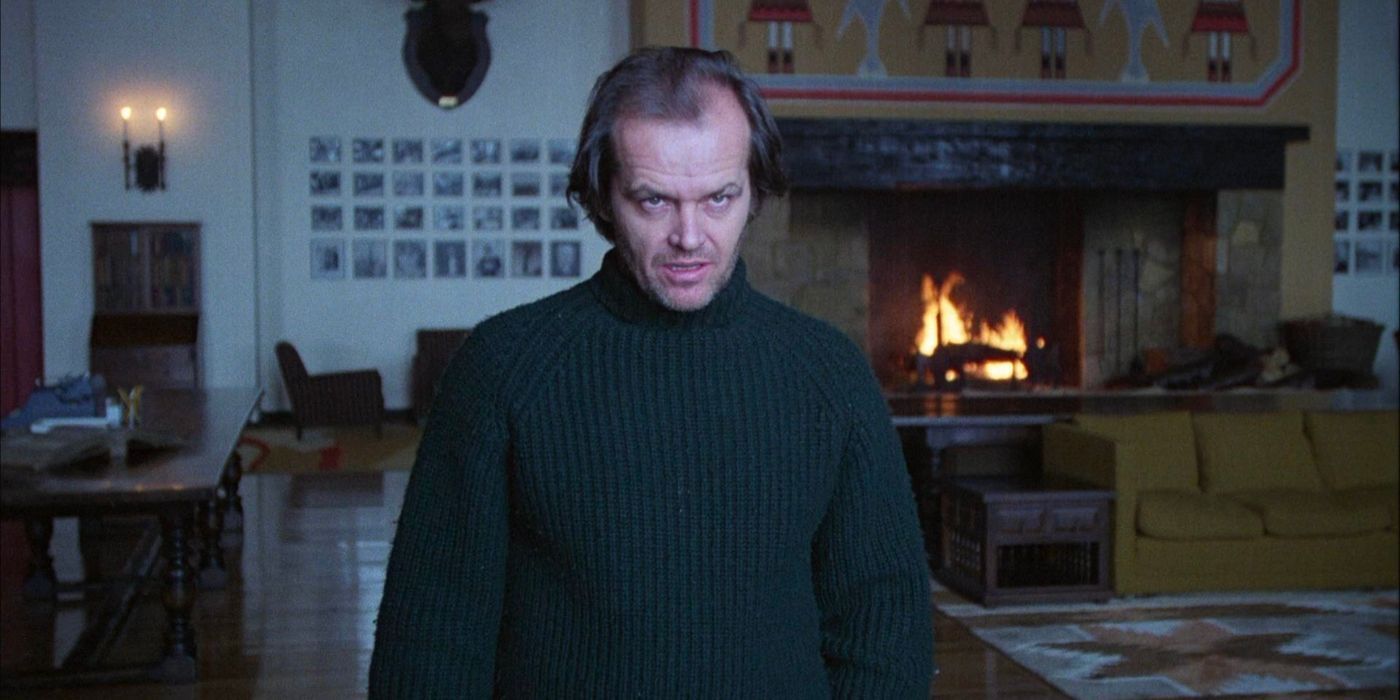 Jack Nicholson's Jack Torrance stares out a window in The Shining